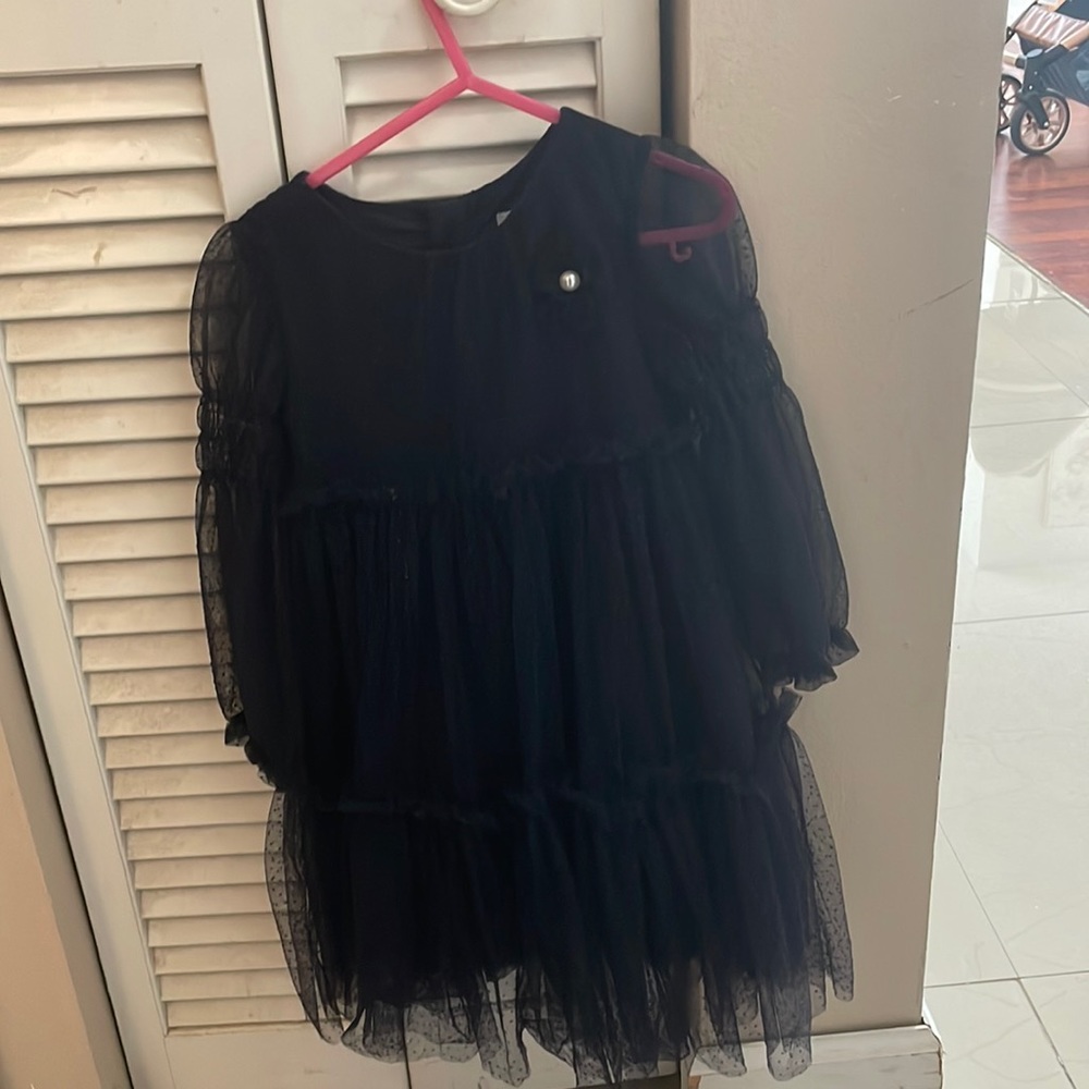 Beautiful  tulle dress from Abel and Lula. The color is navy blue.